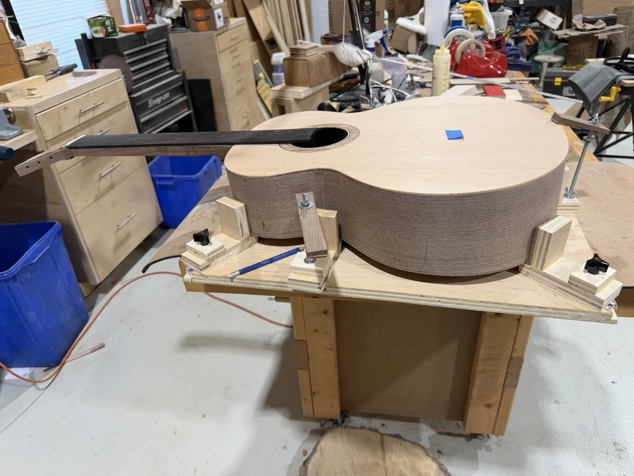 Preparing to add the periling and binding to the acoustic guitar.