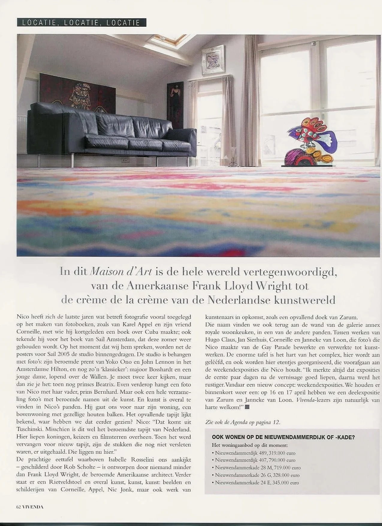 Zarum article in magazine. Interior of a living room with a black leather sofa, abstract artwork on the wall, large windows with curtains, colorful rug, and a sculpture of a peacock in front of the windows.