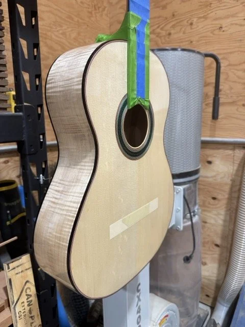 Shown here is a Zarum Flamenco model guitar with a European Spruce top and Curly Maple sides and back.