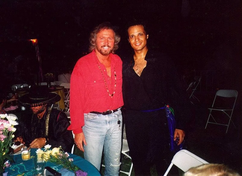 Zarum and Barry Gibb of the Bee Gees at a party at Robin Gibb's home in Miami