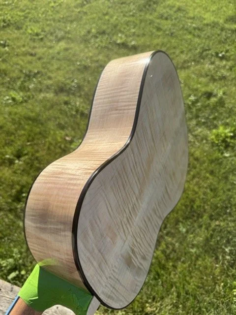 Shown here is a Zarum Flamenco model guitar showing the Curly Maple sides and back.