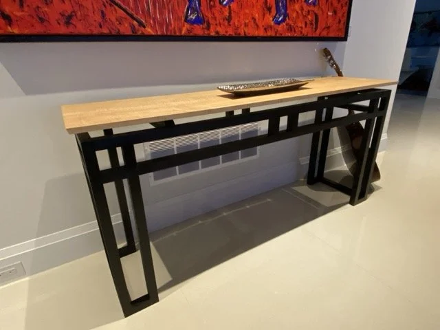 Zarum woodworking skills. Curly maple top side table. The legs are made of maple as well and stained black..