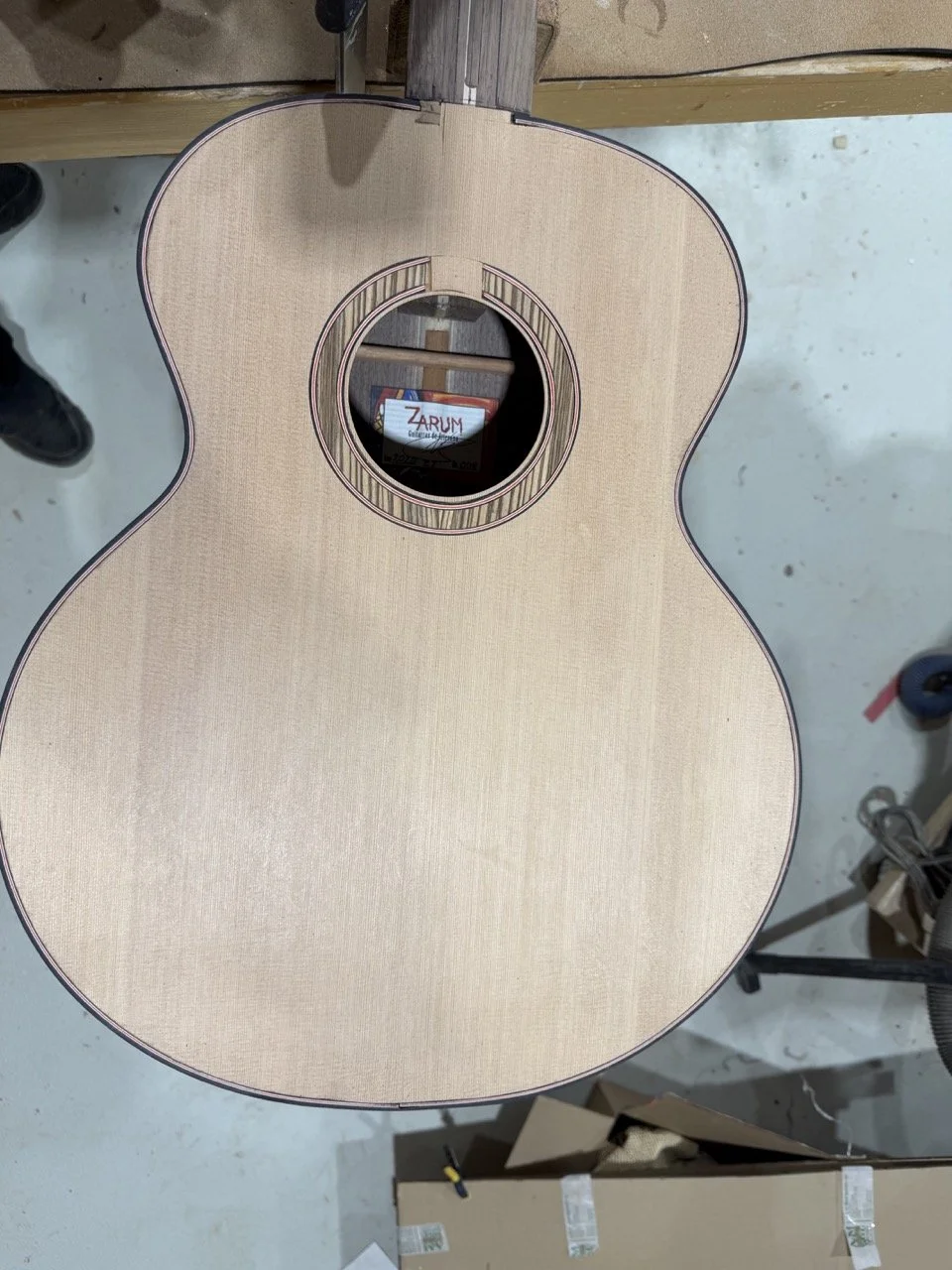 Preparing to add the periling and binding to the acoustic guitar.
