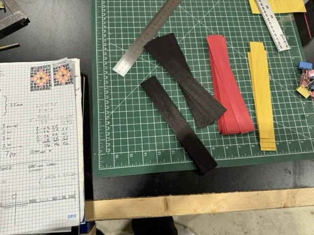 Cutting the coloured wood veneer blanks of .5mm wood for the rosette