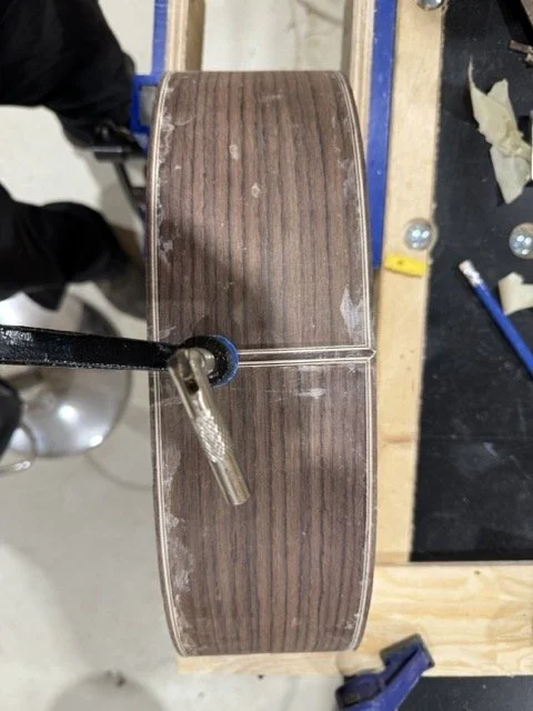 Adding binding trim to the bottom of the guitar 