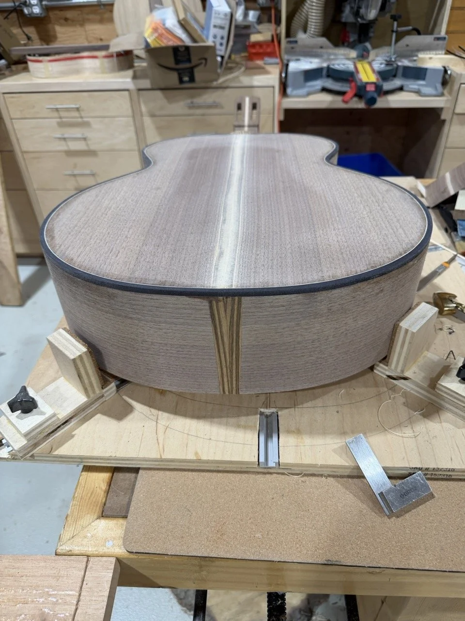 Preparing to add the periling and binding to the acoustic guitar.