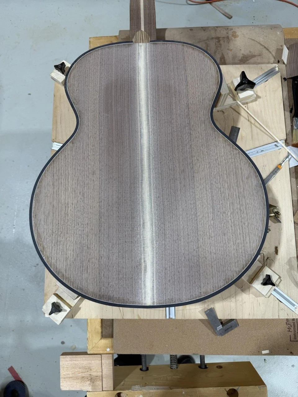 Preparing to add the periling and binding to the acoustic guitar.