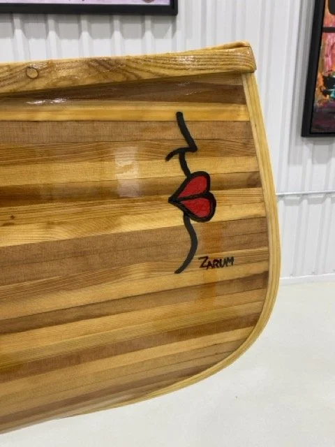 Zarum woodworking skills. Cedar strip canoe with the Zarum signature and a image from his LIPS series of paintings.