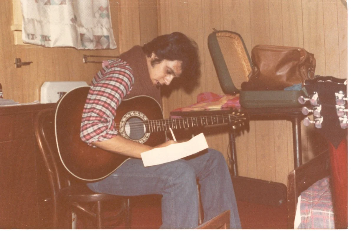 Zarum composing on the guitar while on tour