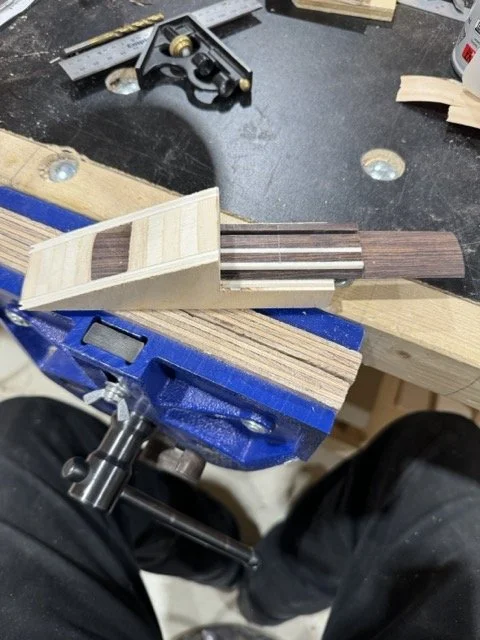 Using another homemade jig, the ends of the bridge are shaped