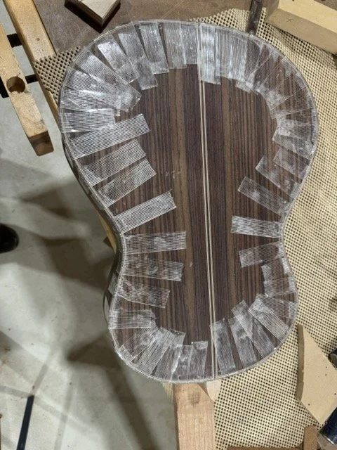 The back and side binding strips glued and drying