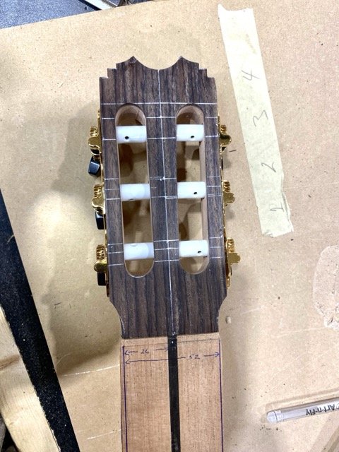 After drilling out the tuner holes and cutting out the channels for the tuners a fit is done