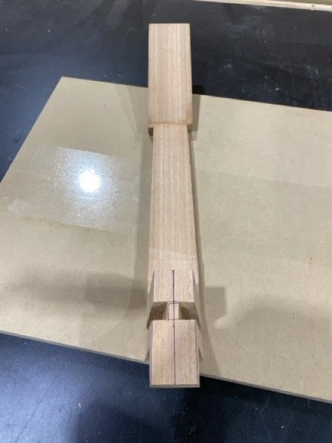 The back of the neck showing the slots chiseled for the sides to sit in