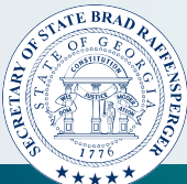 Seal of the Secretary of State of Georgia with an arch and pillars, text around the circle, and 1776 date.