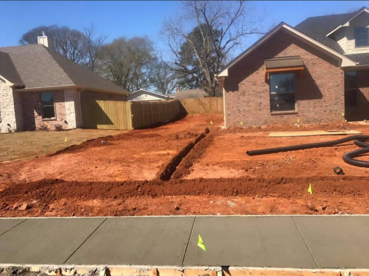 Front view of a house with a new irrigation install.