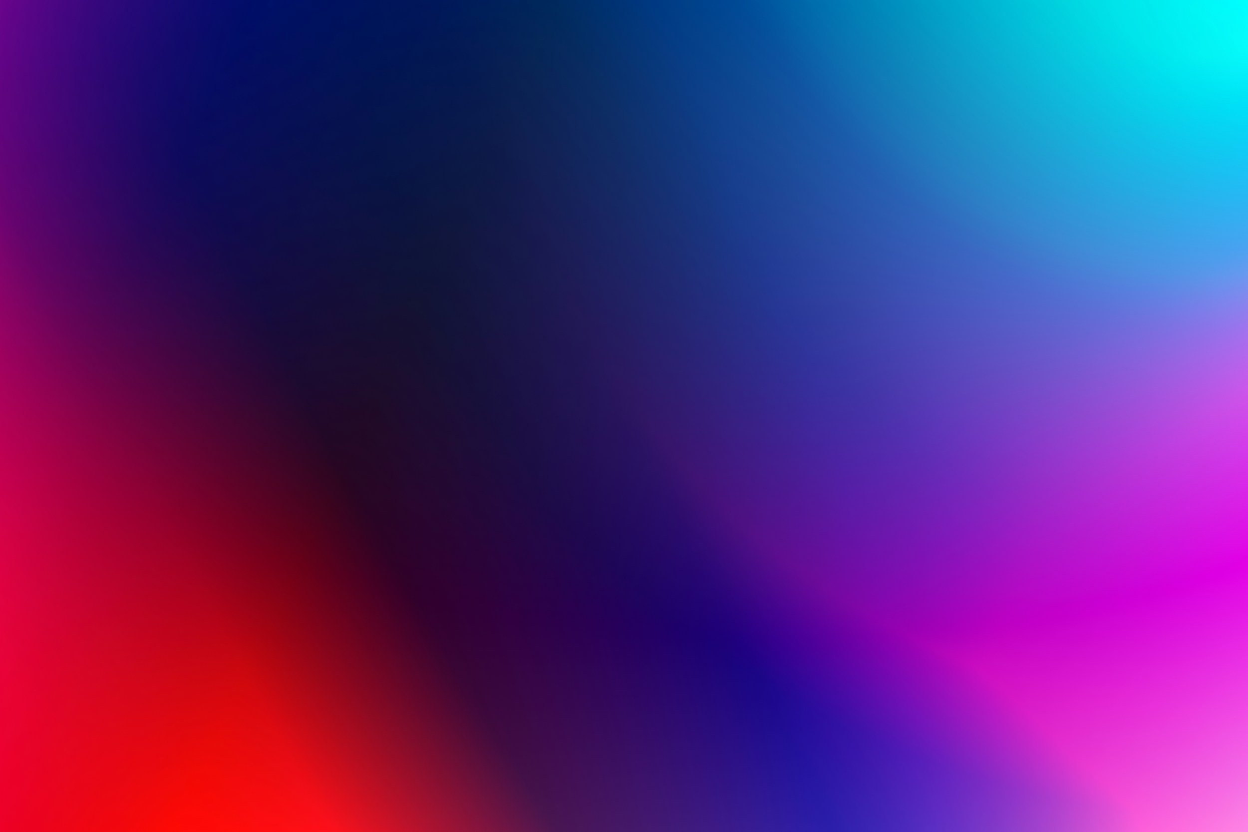 Abstract colorful gradient with shades of pink, purple, blue, and black blending smoothly.