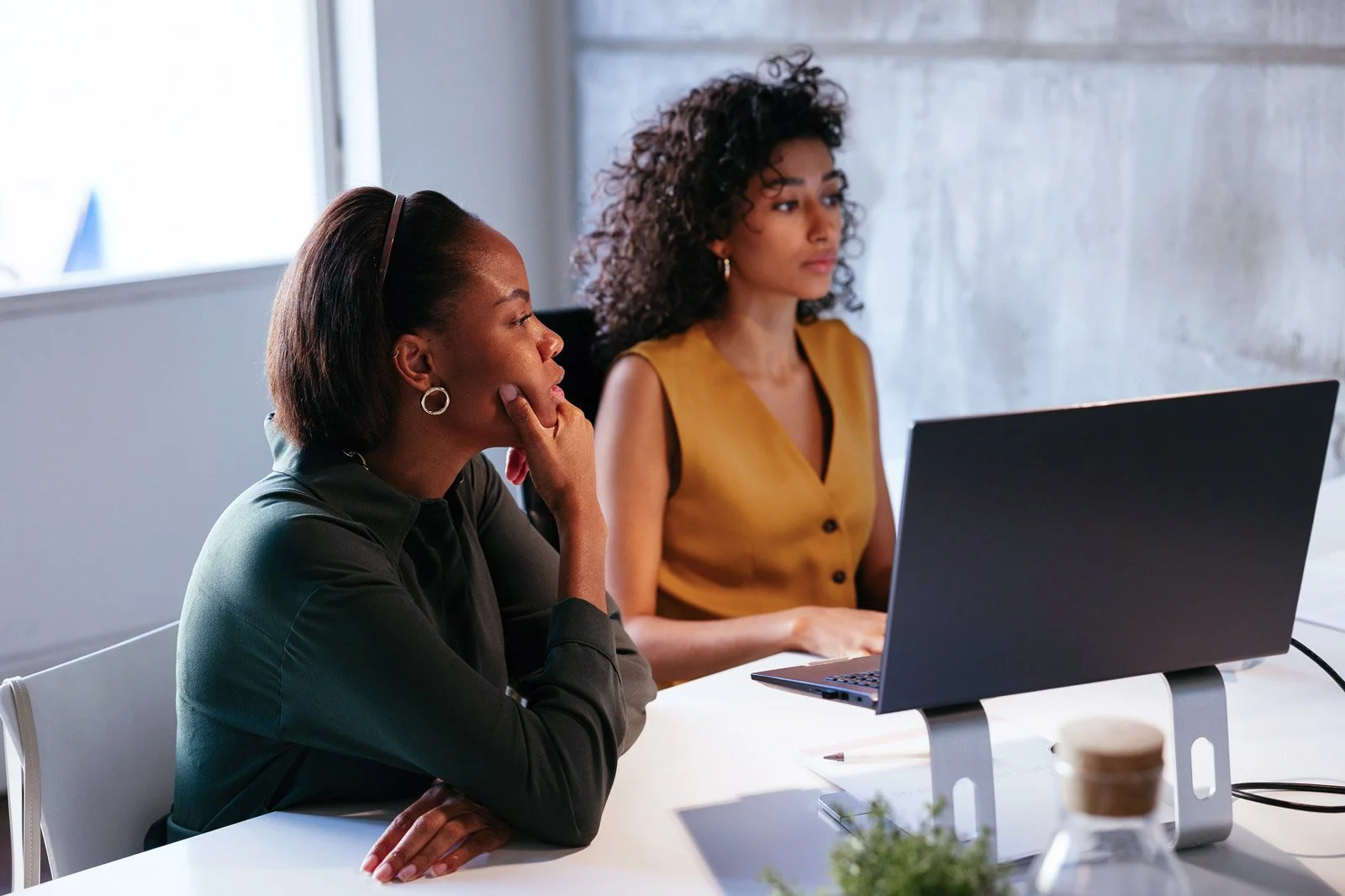 HR consultants reviewing information together at a desk.