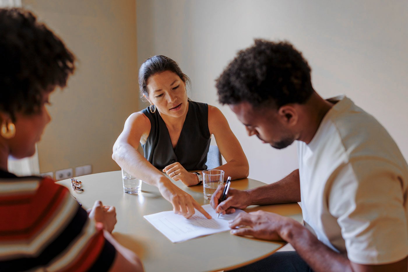 Employment law advisor reviewing documents with clients.