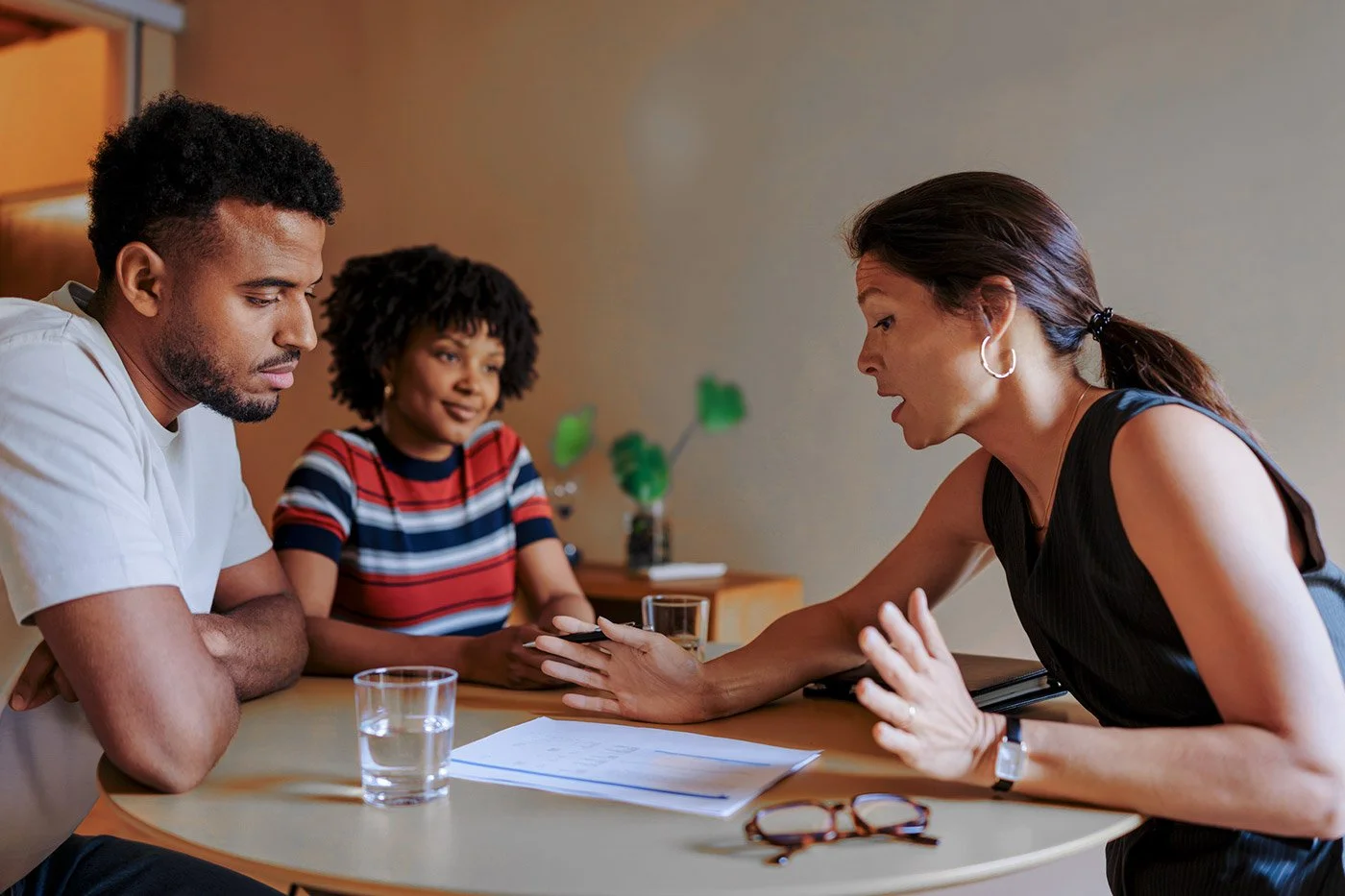 Workplace investigation meeting with legal and HR professionals.