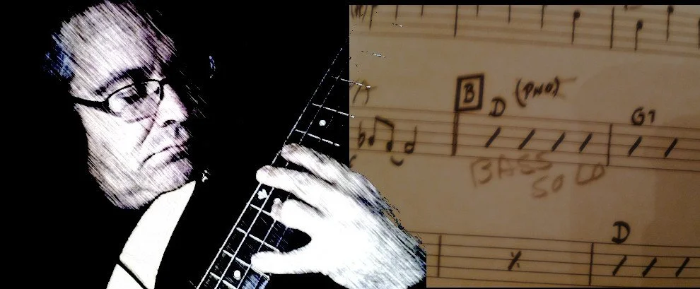 A person with glasses playing guitar, alongside handwritten music notes and chords on a sheet of paper.