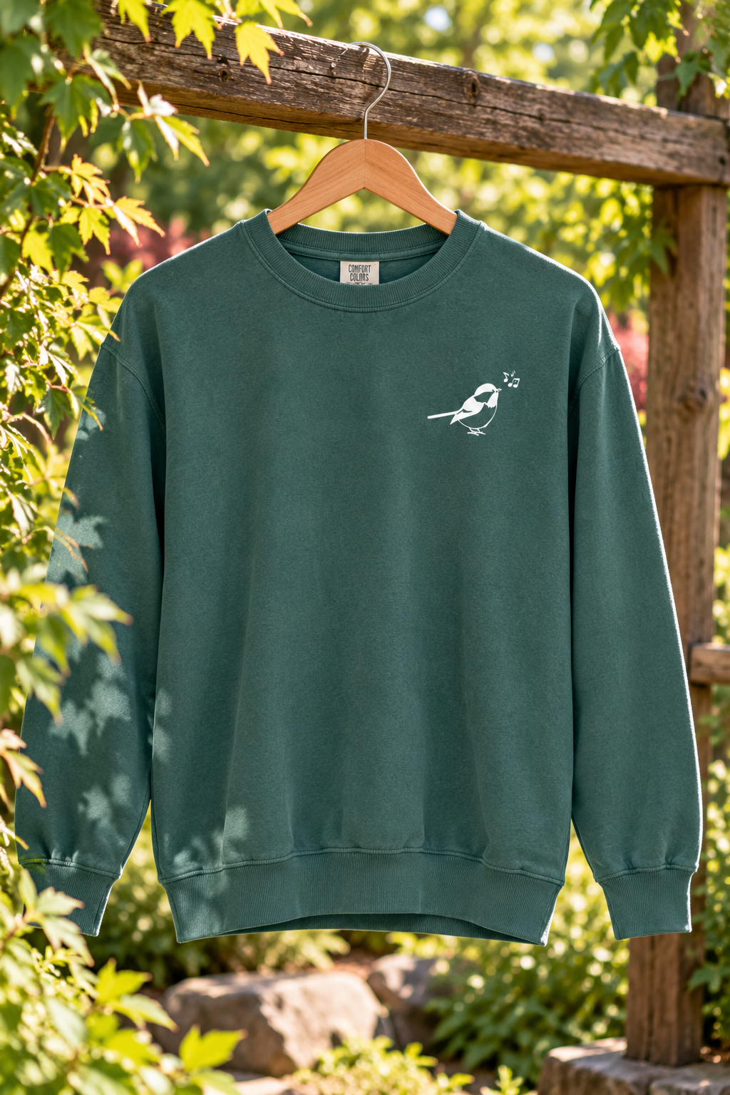 Forest Green Bird-Print Sweatshirt in a Sunlit Garden.png