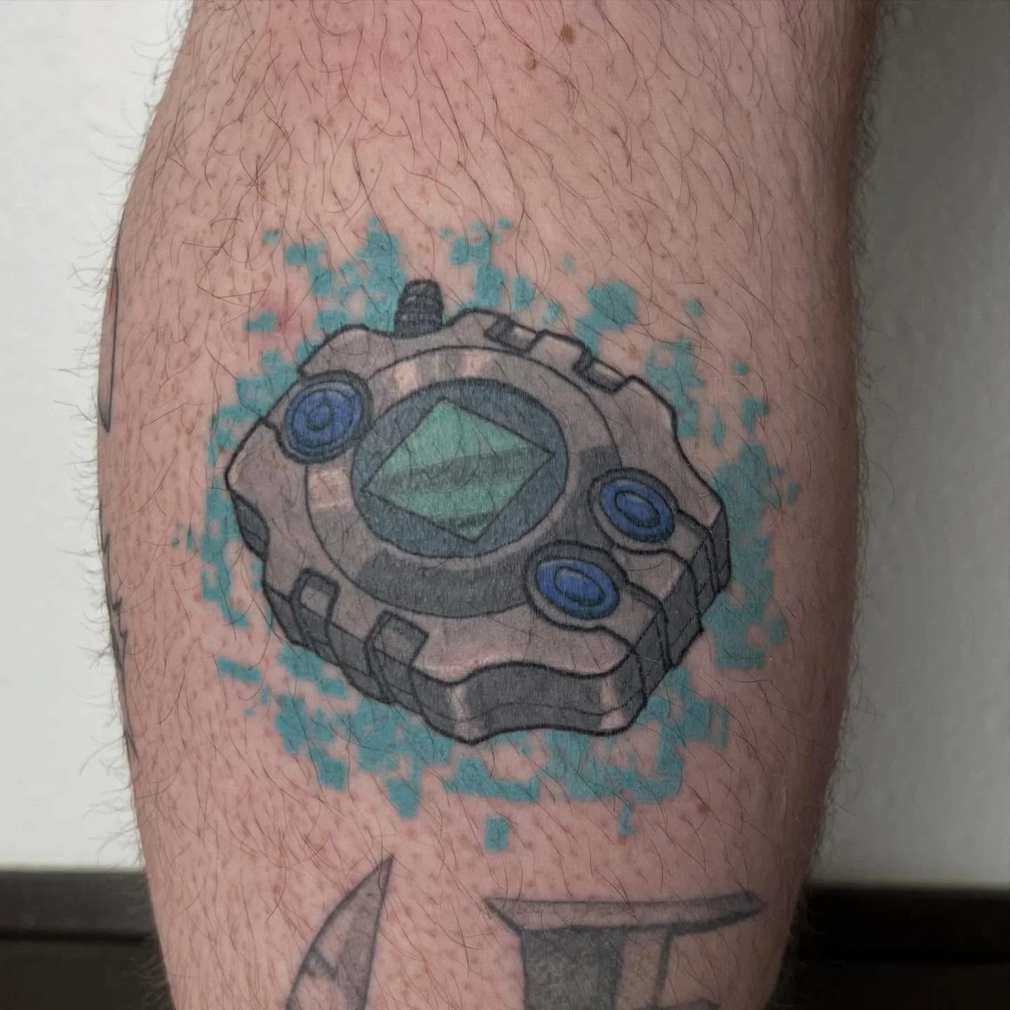 Got to snag this healed picture of the digivice I did a while back. I love how it turned out! 

On a different note I had a cancellation for Saturday. So if you&rsquo;ve been thinking about getting a tattoo maybe this is your sign to come get tattooe