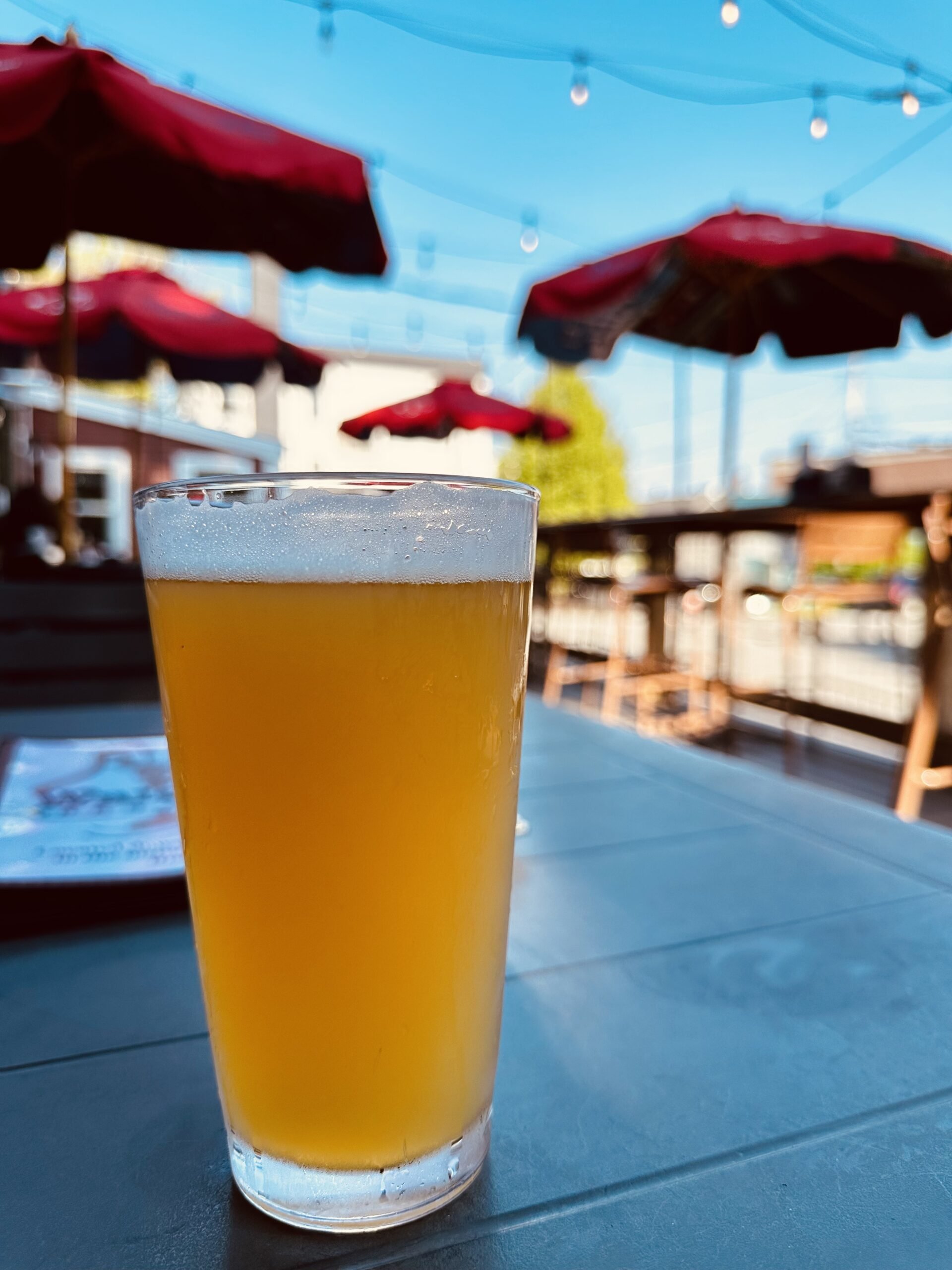A refreshing perfectly served cold draft beer on the patio on a summer day in Rockland, Maine at the Waterworks restaurant