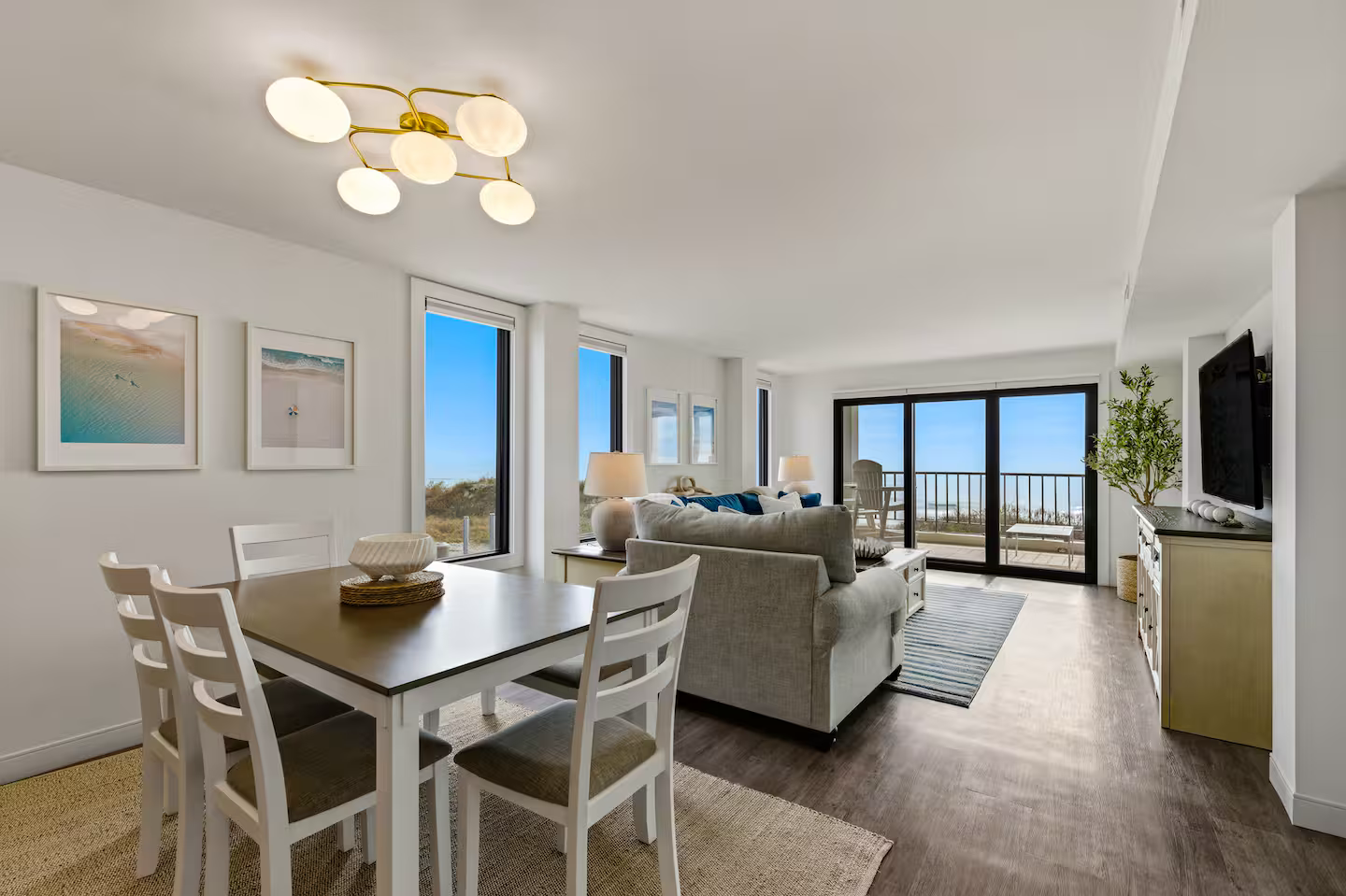 Stylish dining area with ocean views - modern coastal décor and seating for the whole group.
