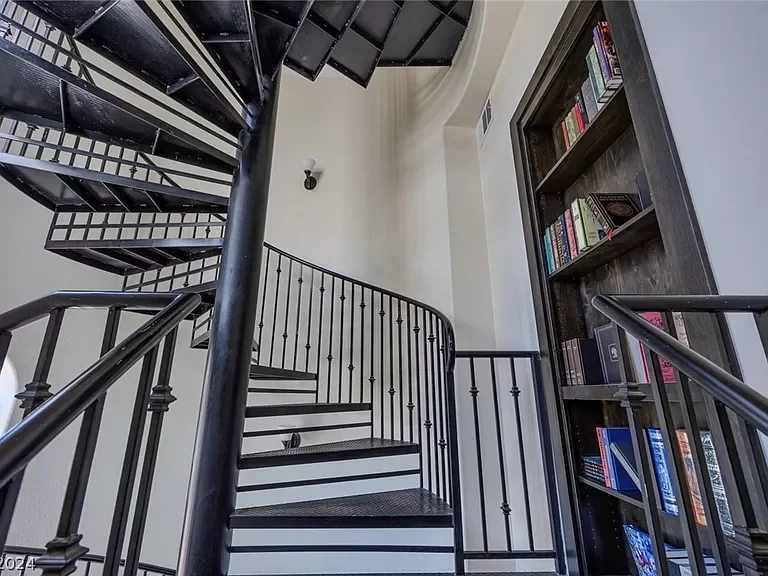 Secret library with hidden bookcase entry and fireplace at The Castle vacation rental in Henderson near Las Vegas