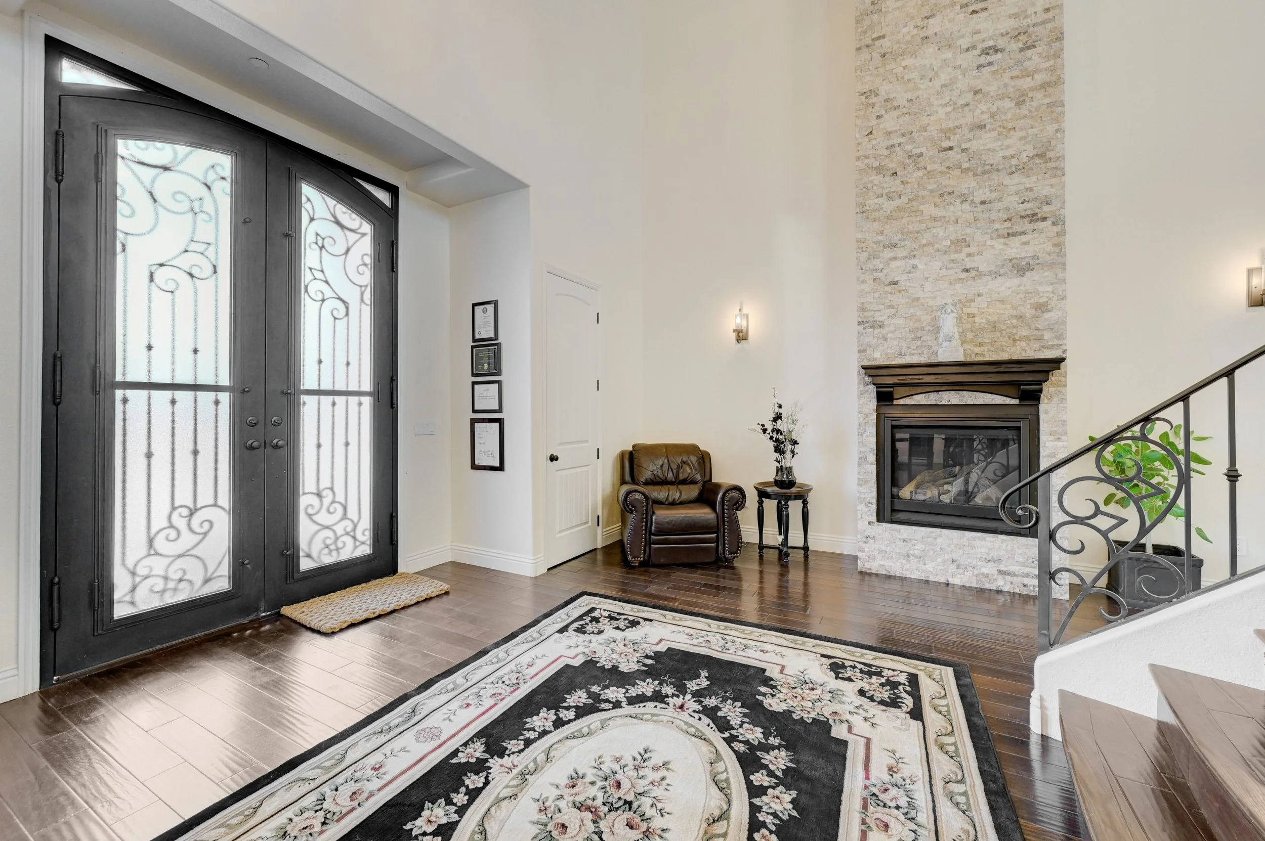 Main level suites accessed from the grand entry foyer at The Castle luxury vacation rental in Henderson near Las Vegas