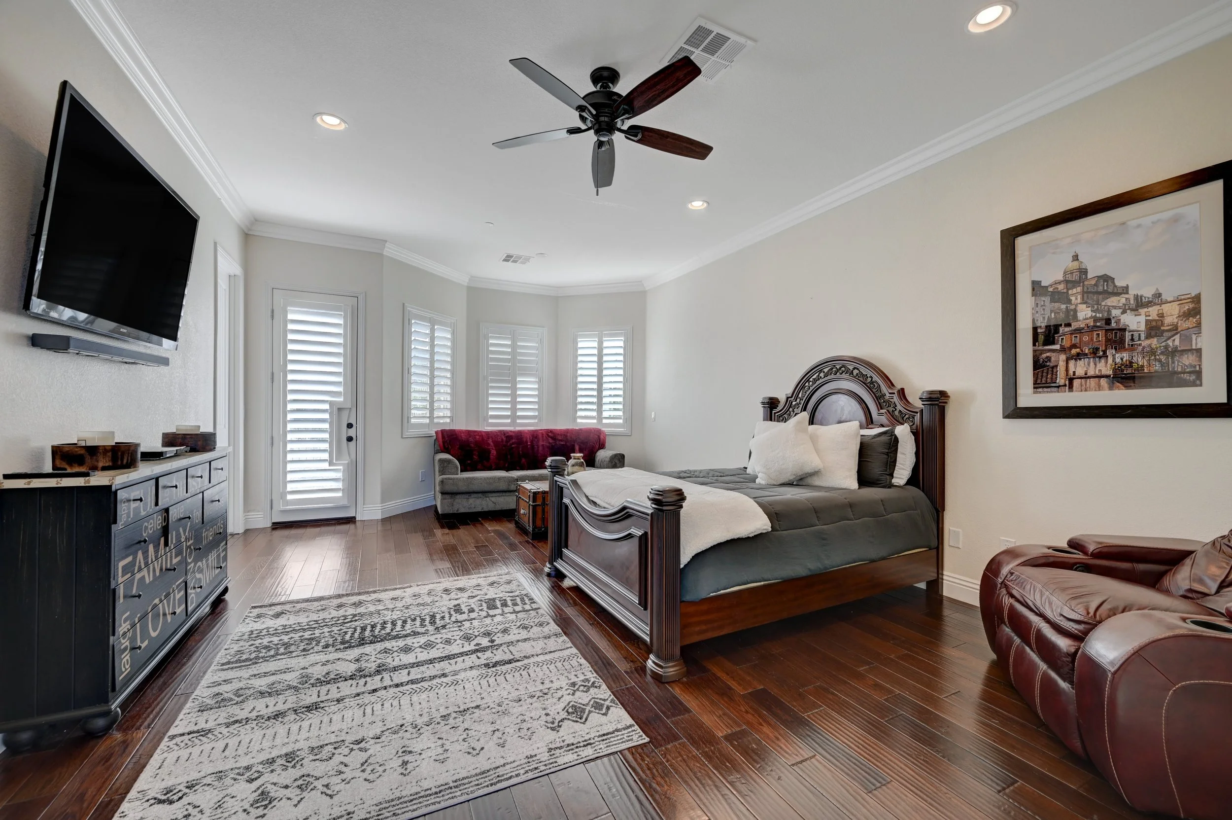 ourtyard bedroom with queen bed, en-suite bathroom, and private access to fountain courtyard at The Castle luxury vacation rental in Henderson near Las Vegas