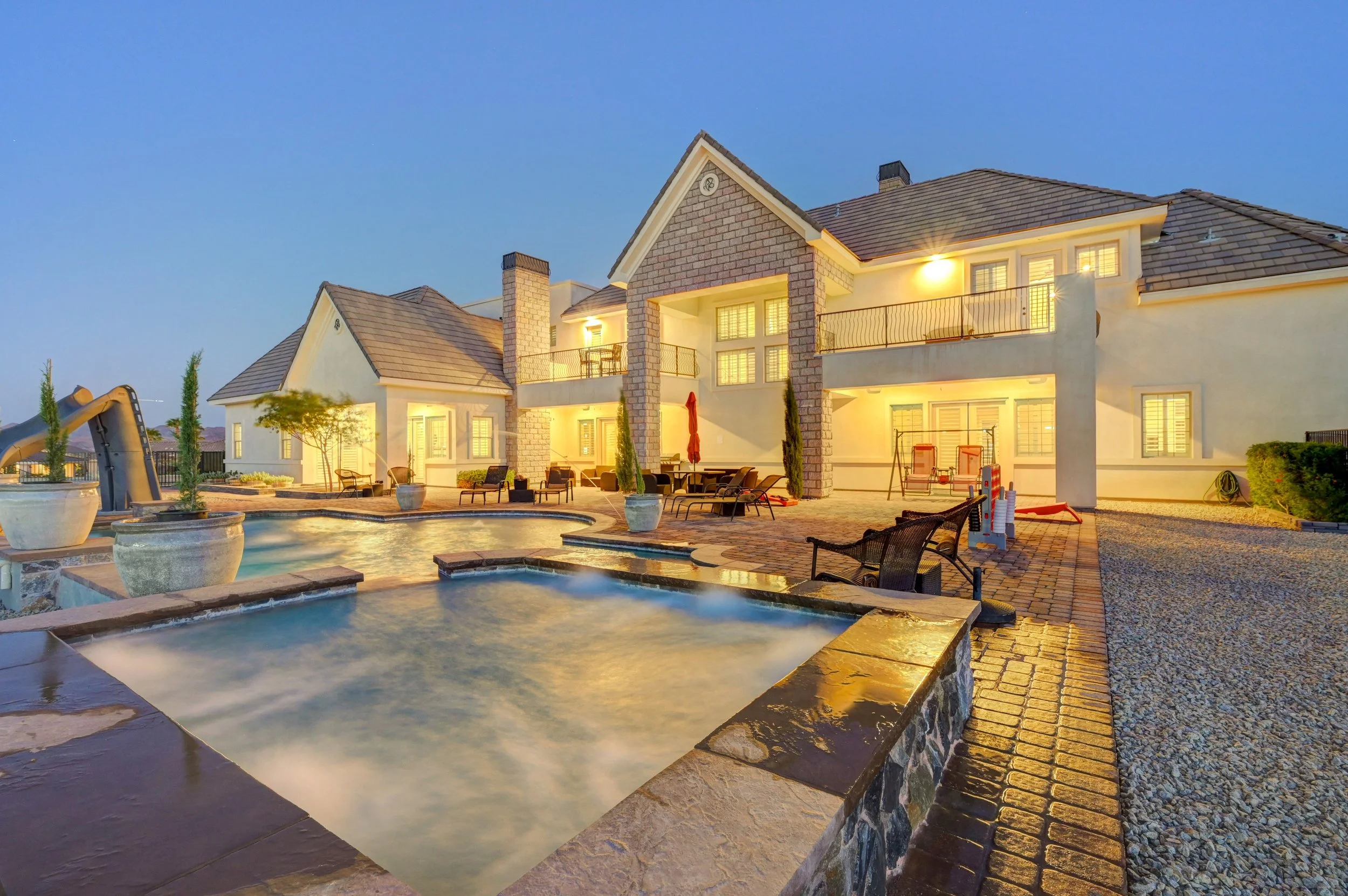 Resort-style pool and spa at The Castle luxury vacation rental in Henderson near Las Vegas with outdoor lounge 