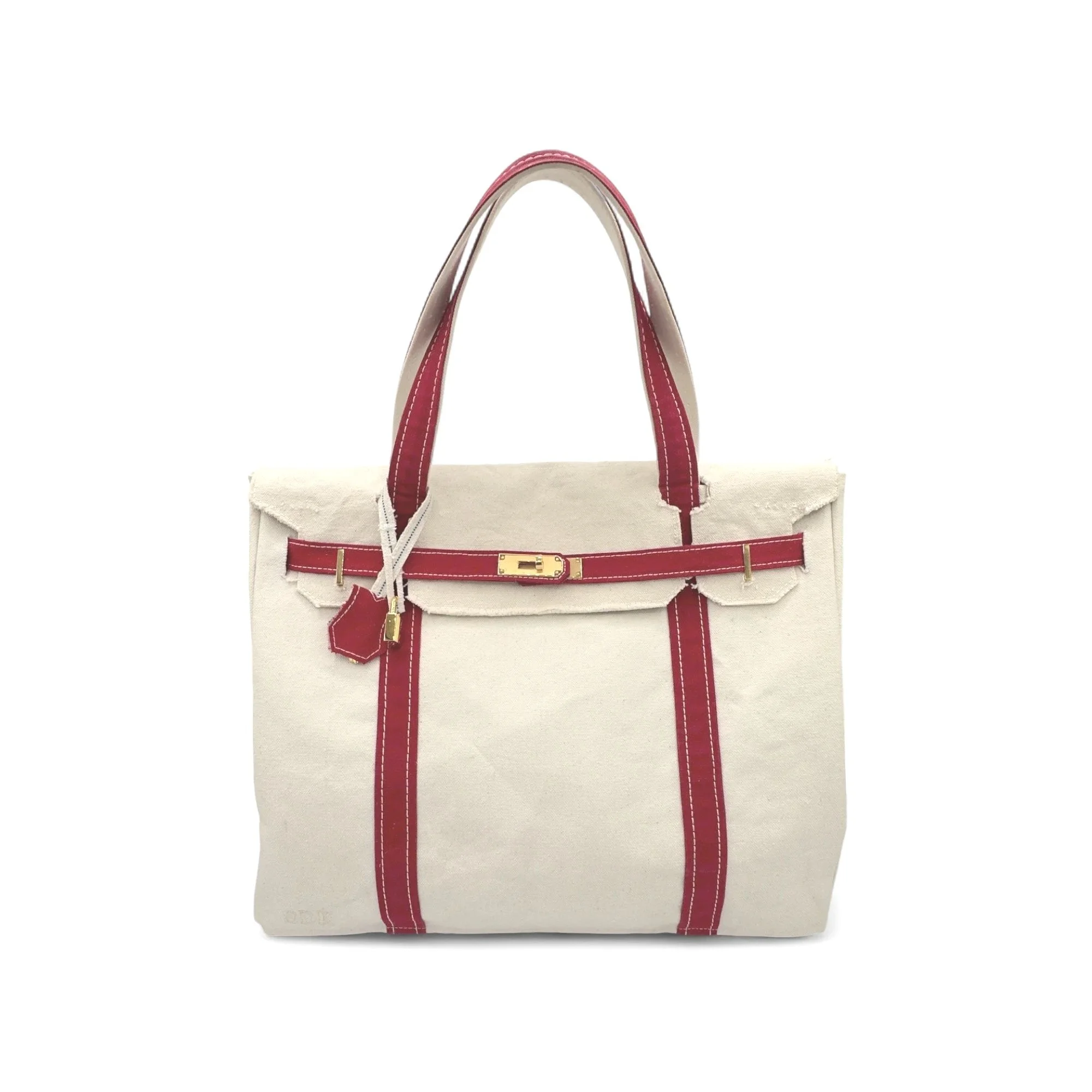 Cream-colored tote bag with red leather accents, red straps, and a gold clasp. Boatkin inspired upcycled L.L. Bean Tote vintage 1970's