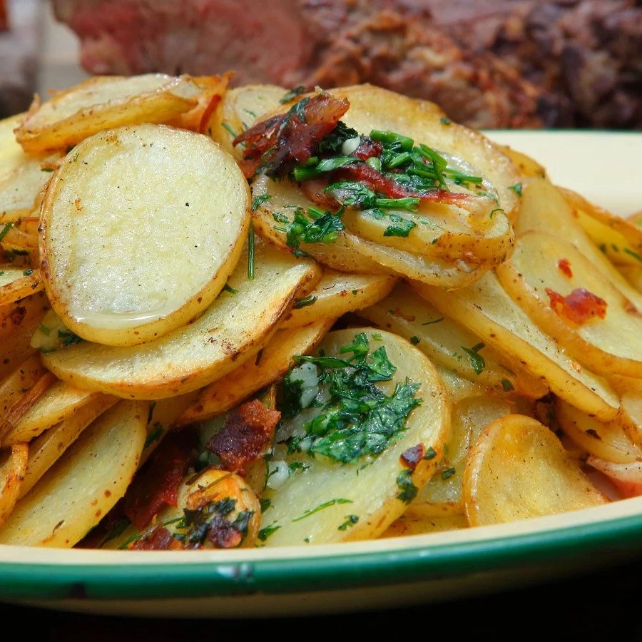 🥔✨ Forget boring mashed or fries&mdash;let me introduce you to Patatas Panaderas. This Spanish classic takes thinly sliced potatoes, onions, olive oil, and a splash of white wine, and bakes them into pure comfort food. Crispy edges, soft centers, an