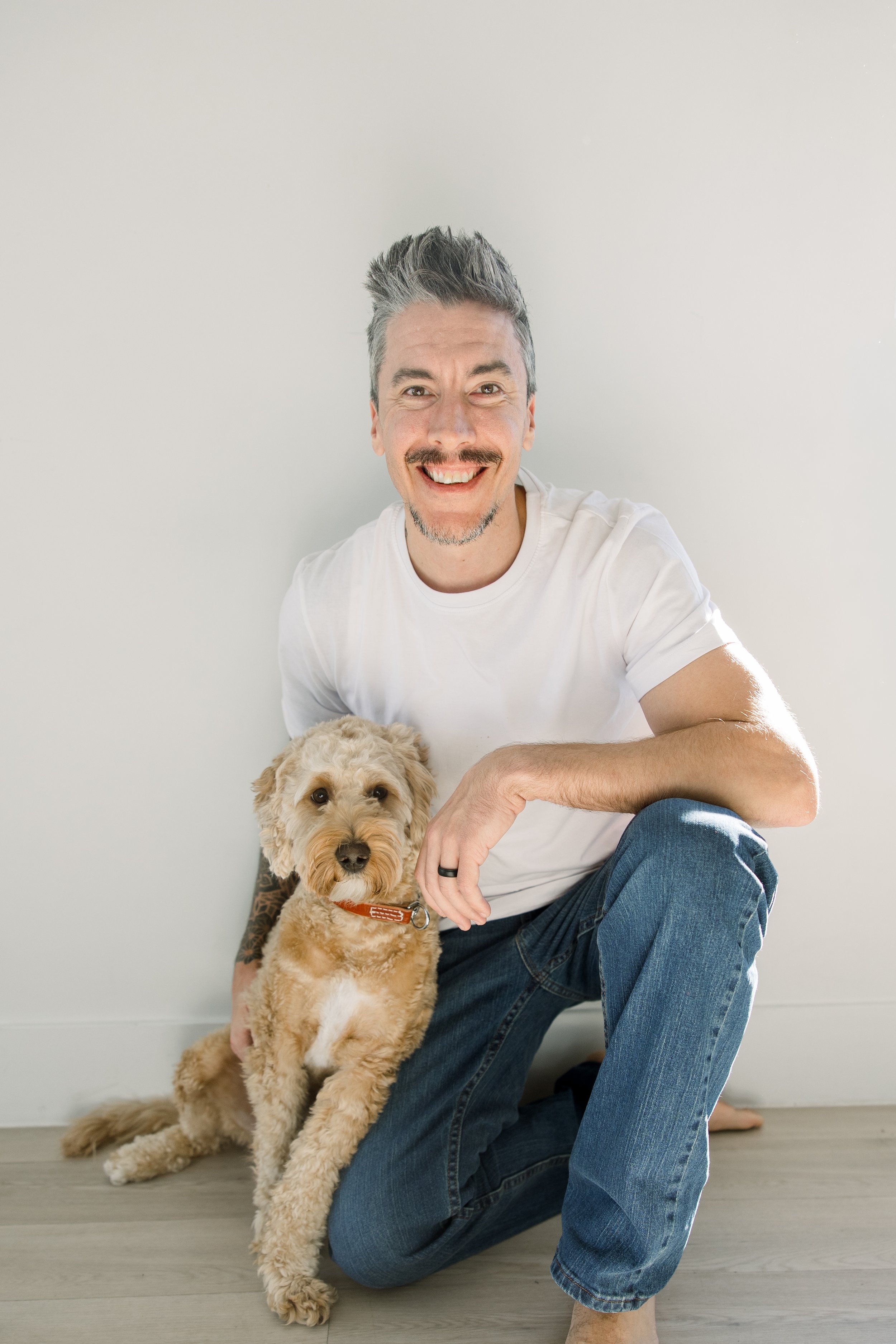 "Josh Spencer with Cooper the Golden Doodle, Align Canine"