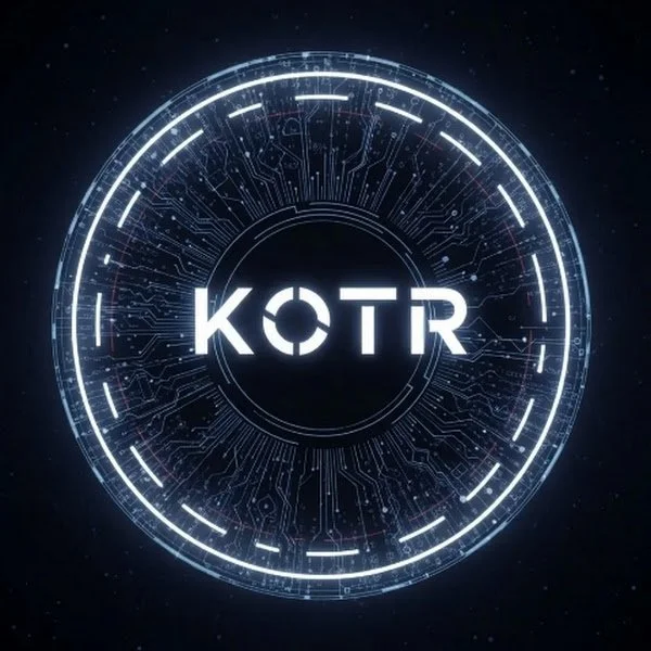 Futuristic digital clock or interface with the text "KOTR" in the center, surrounded by a glowing circular pattern against a dark background.