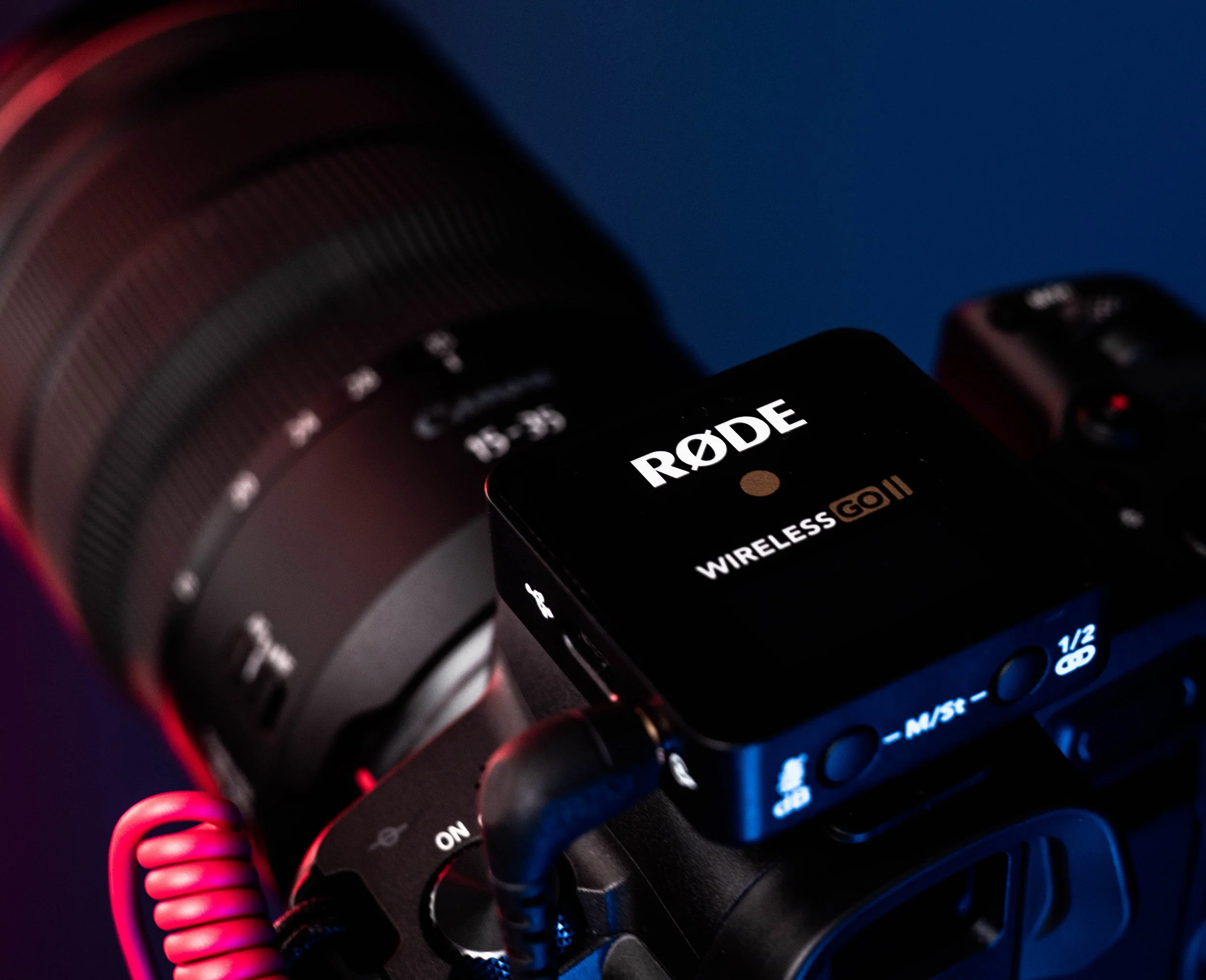 Close-up of a black electronic device displaying the word 'RODE' and 'WIRELESS GO II'