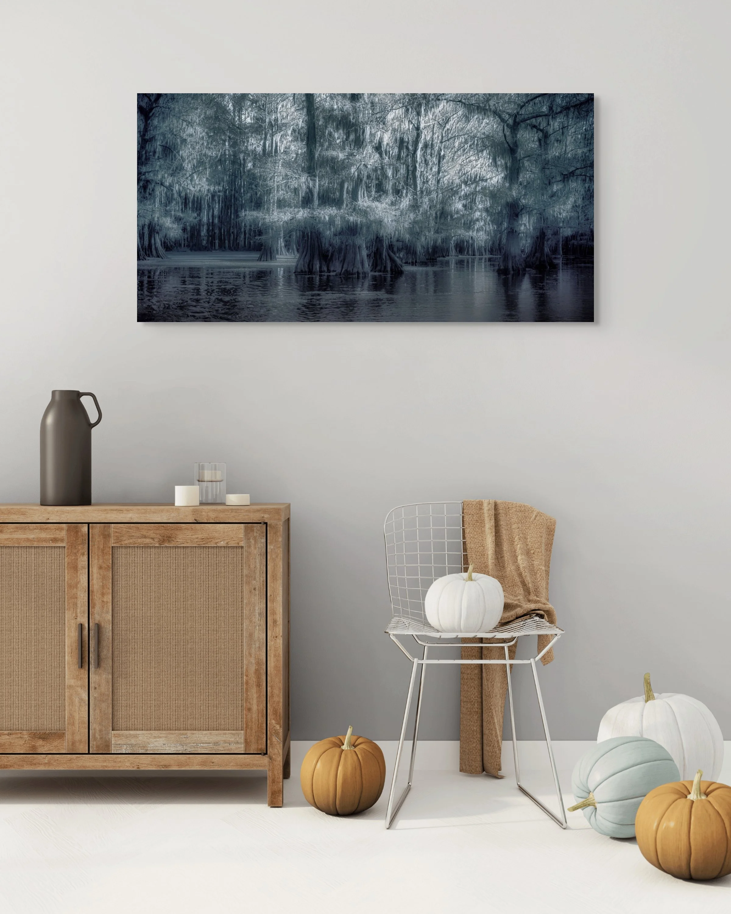 Moody blue-toned infrared photograph of Caddo Lake cypress swamp at twilight with ethereal atmosphere and perfect reflections in still water