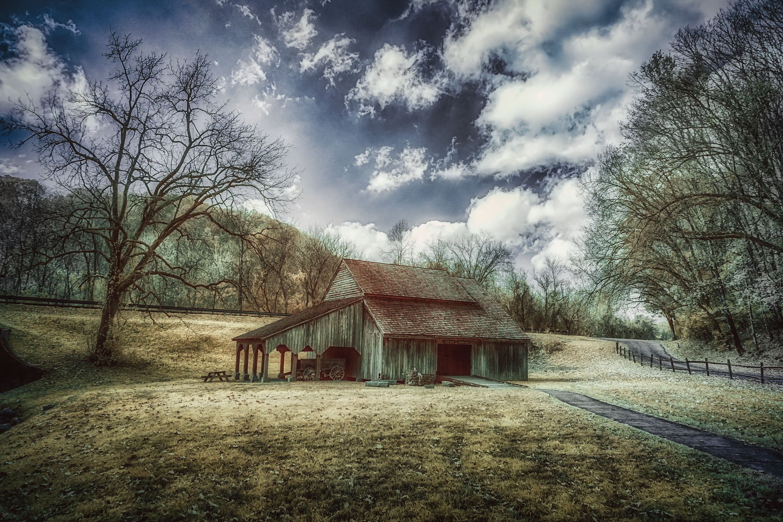 Aged — A weathered barn in the Tennessee hills turns to silhouette against a warm, fading sky.