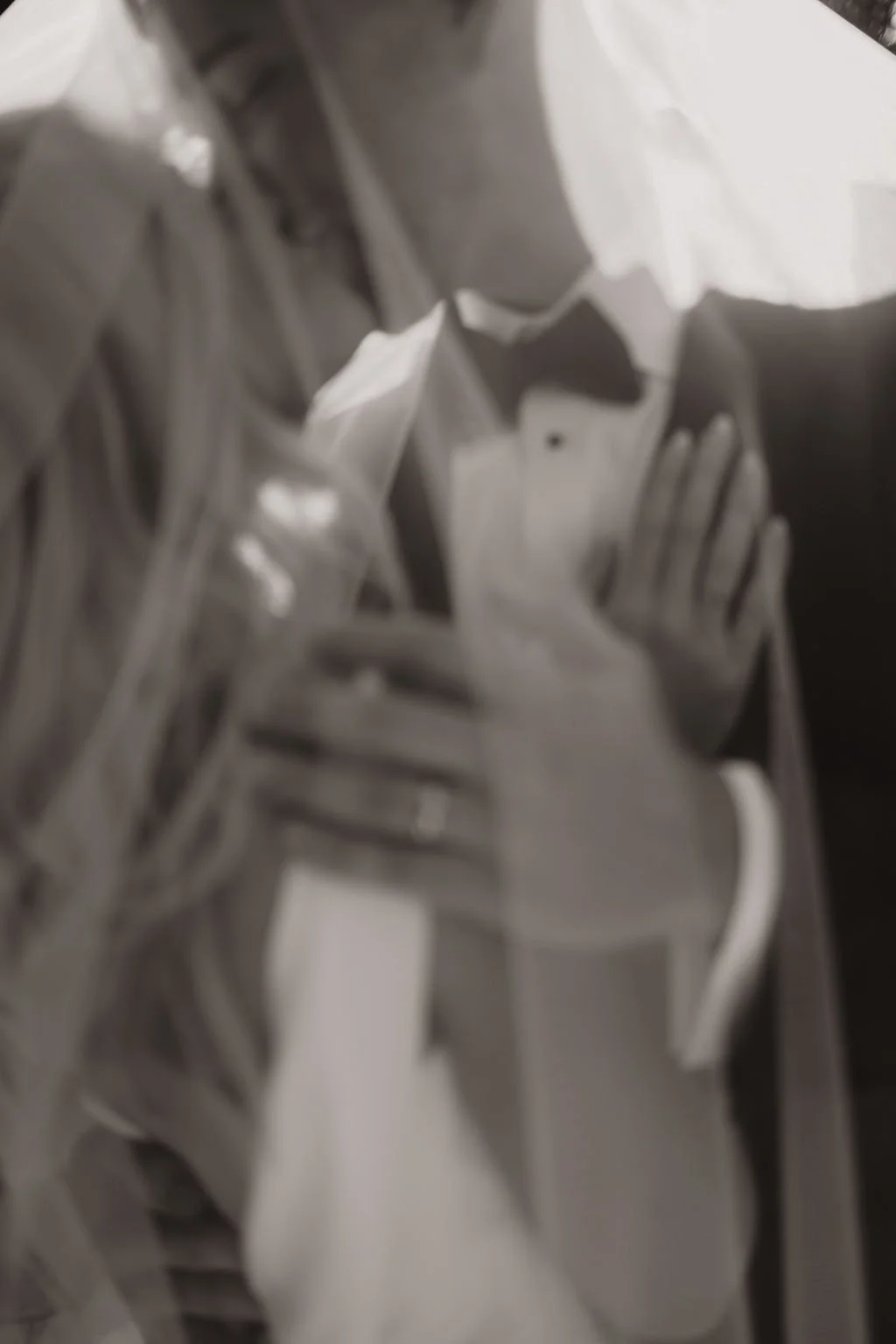 Omaha Nebraska wedding photographer. trendy black and white photo of couple's rings. reception to follow at the Empire Room Omaha Nebraska