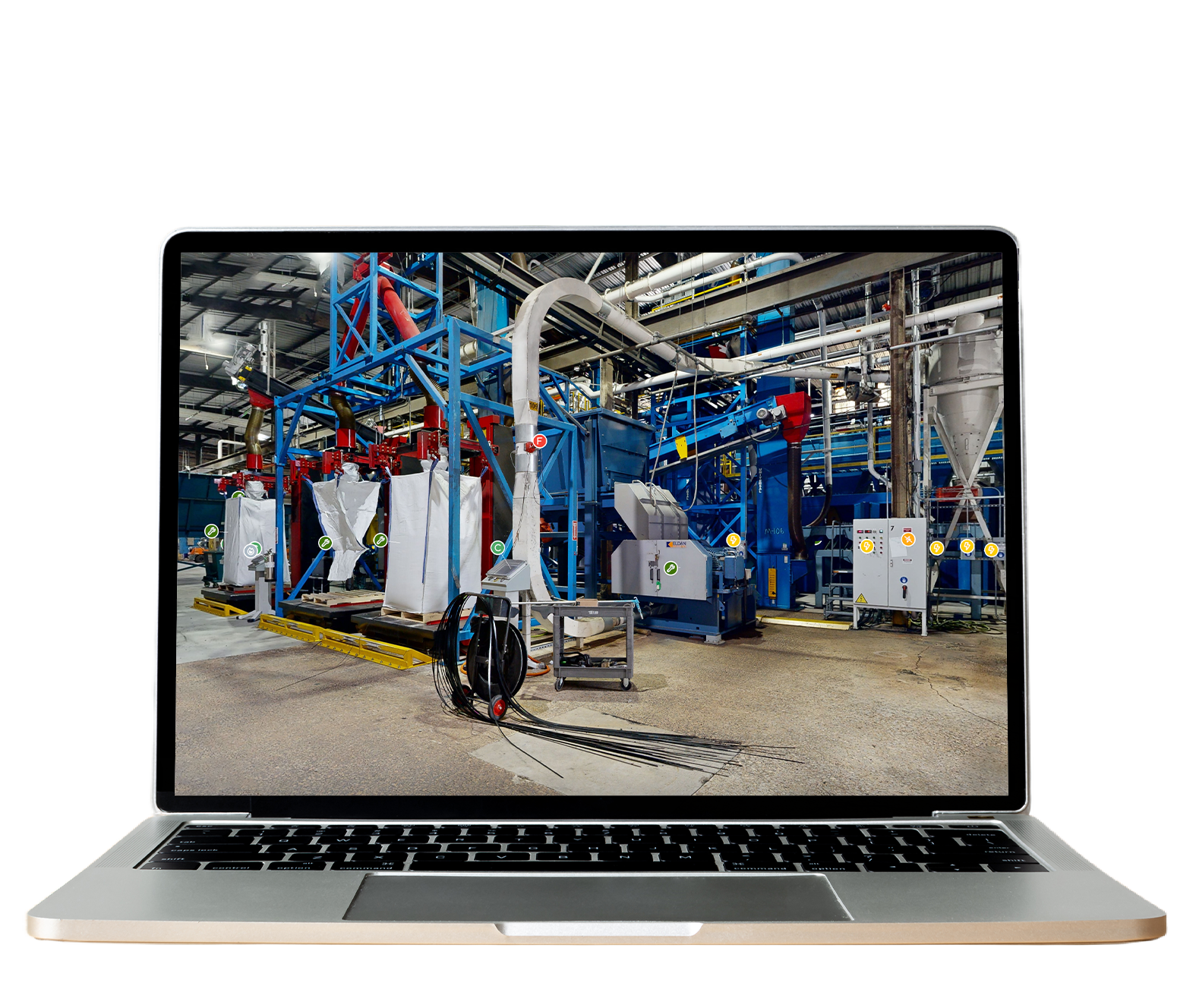Industrial factory with blue machinery and white bags, pipes, and control panels.