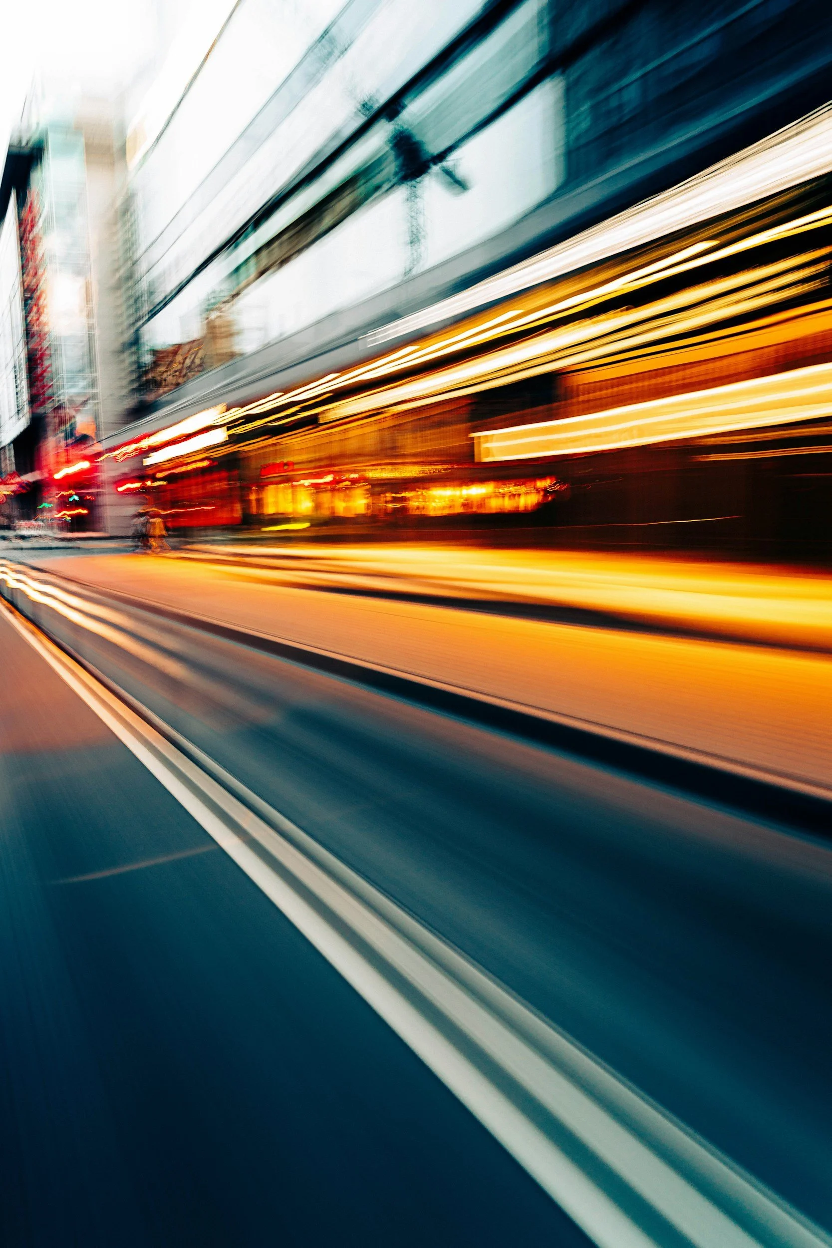 an image of a street and building blurred by speed