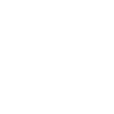 Person standing in front of a group of three seated people with a presentation board