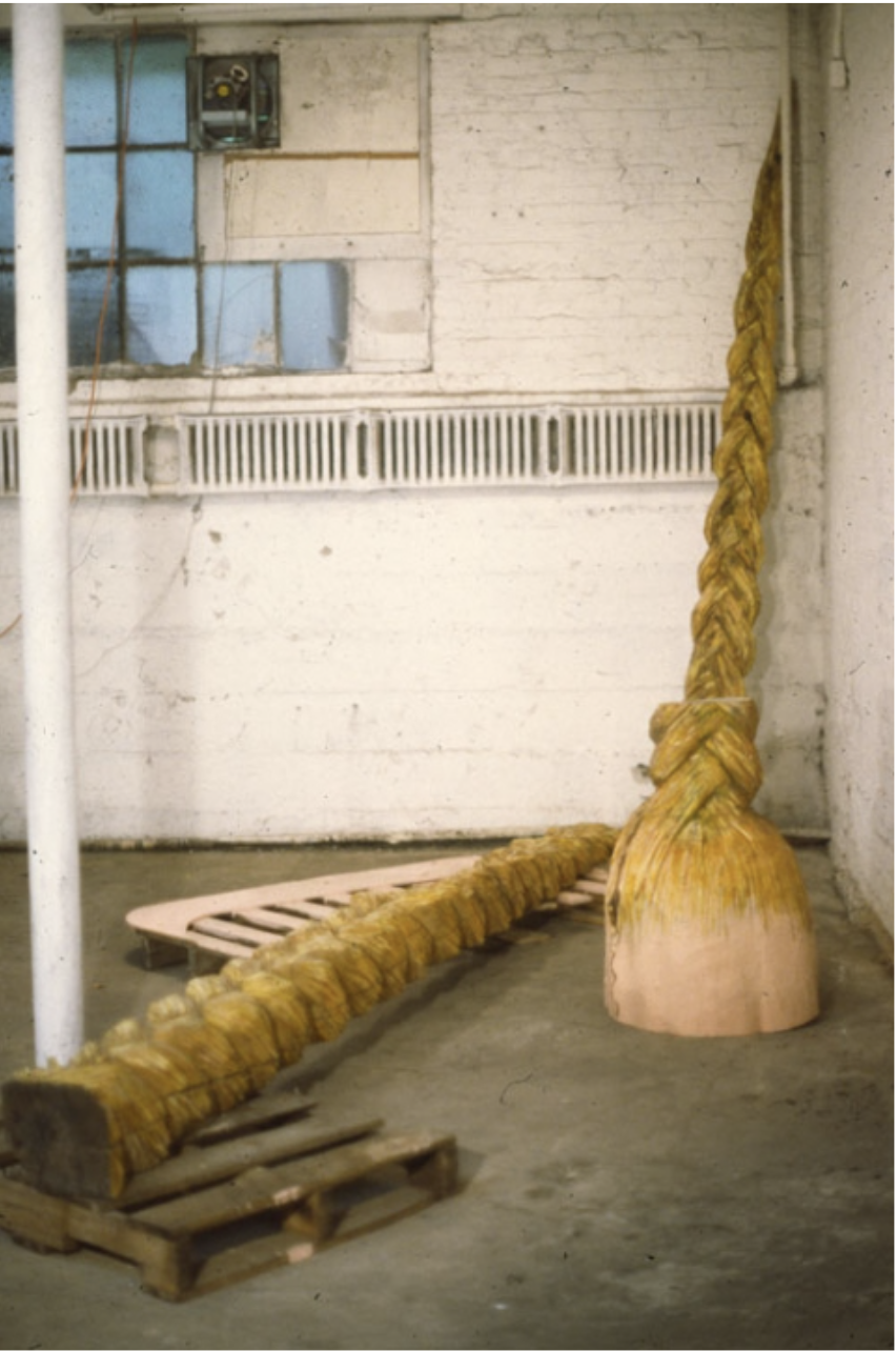 Installation shot of "Rapunzel", Chainsawed logs and altered pallet, 1990
