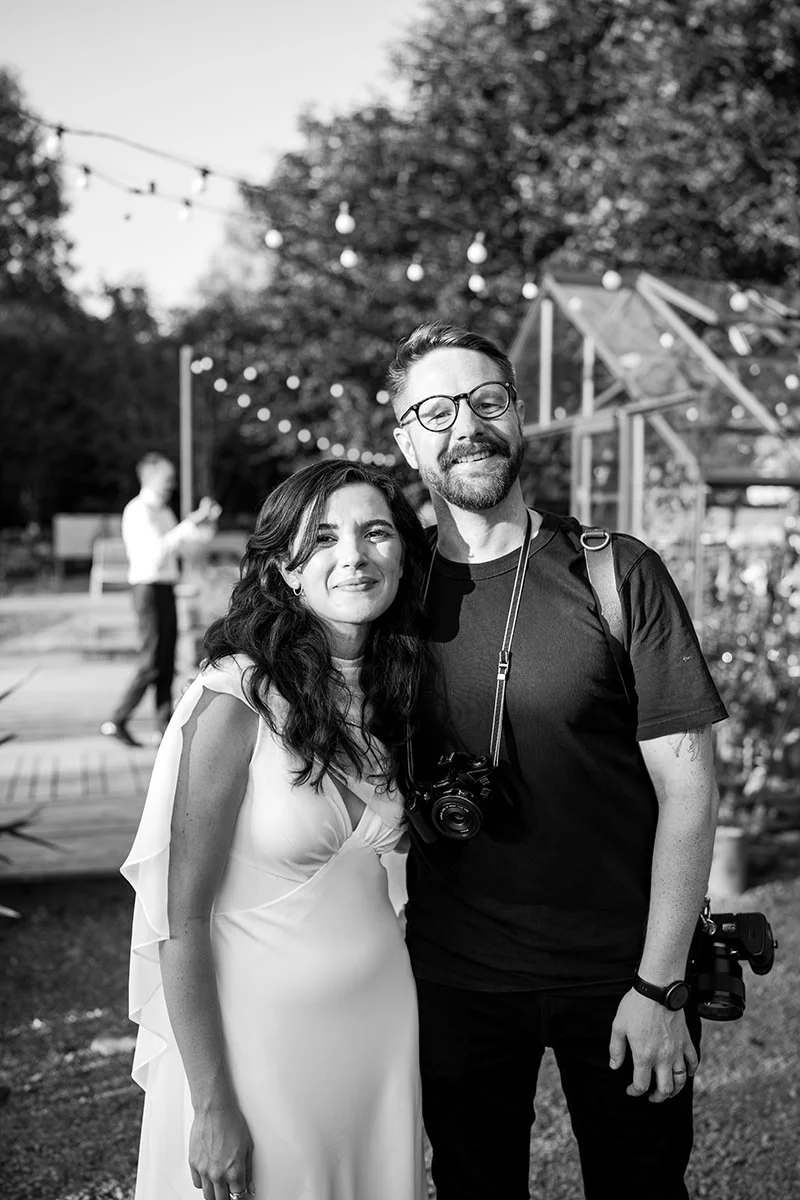Wedding photographer Andy Hamilton standing with a bride at Kilmartin Castle wedding in Scotland