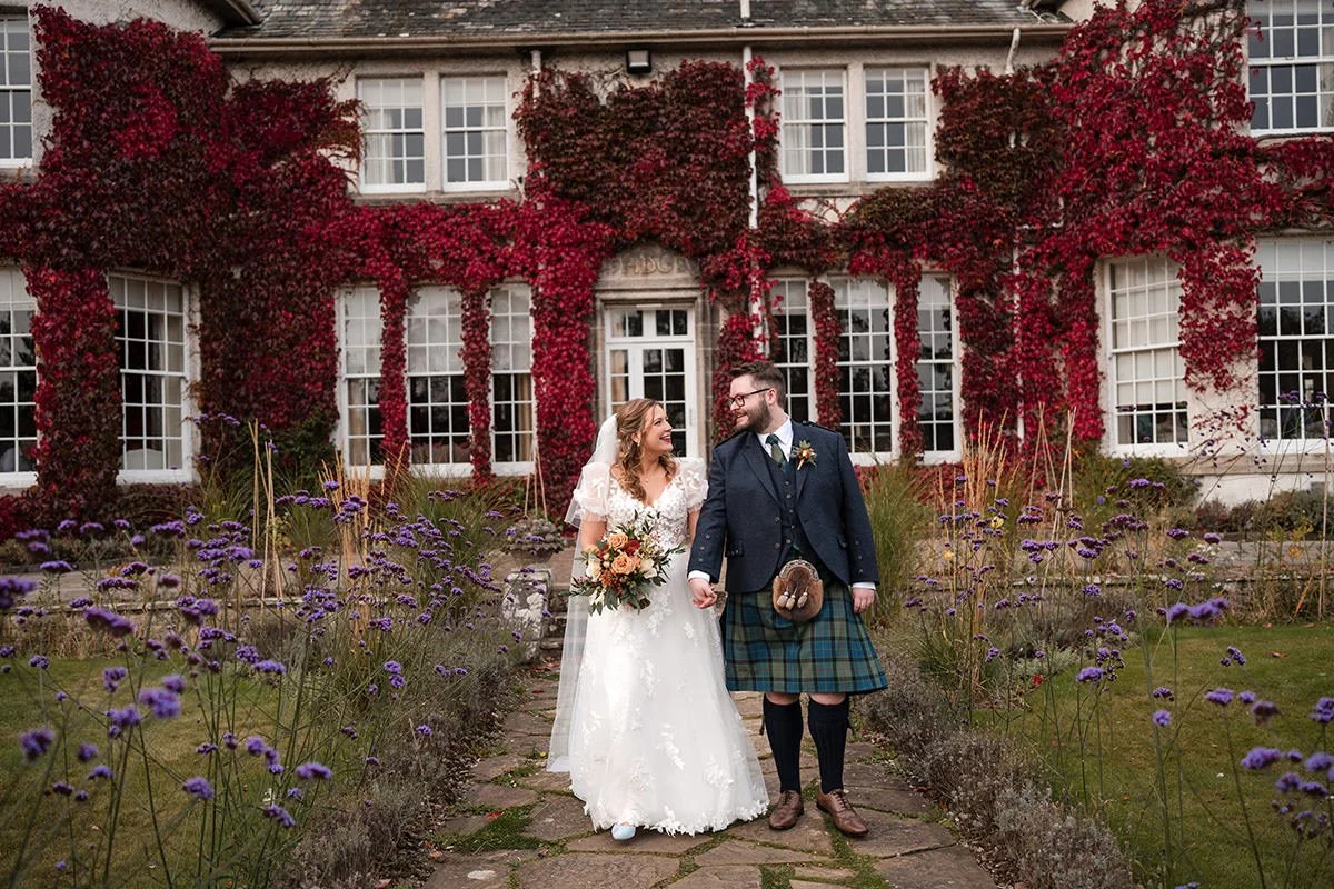 Bride and groom during an autumn wedding portrait at Rufflets St Andrews, photographed by a St Andrews wedding photographer in the hotel gardens