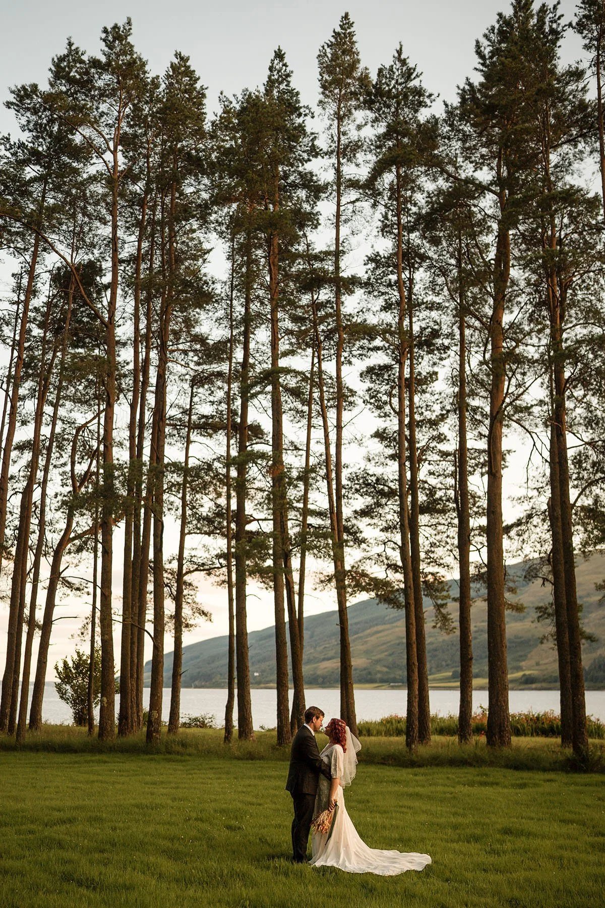 Couple sharing a quiet moment during a lochside elopement in the Scottish Highlands