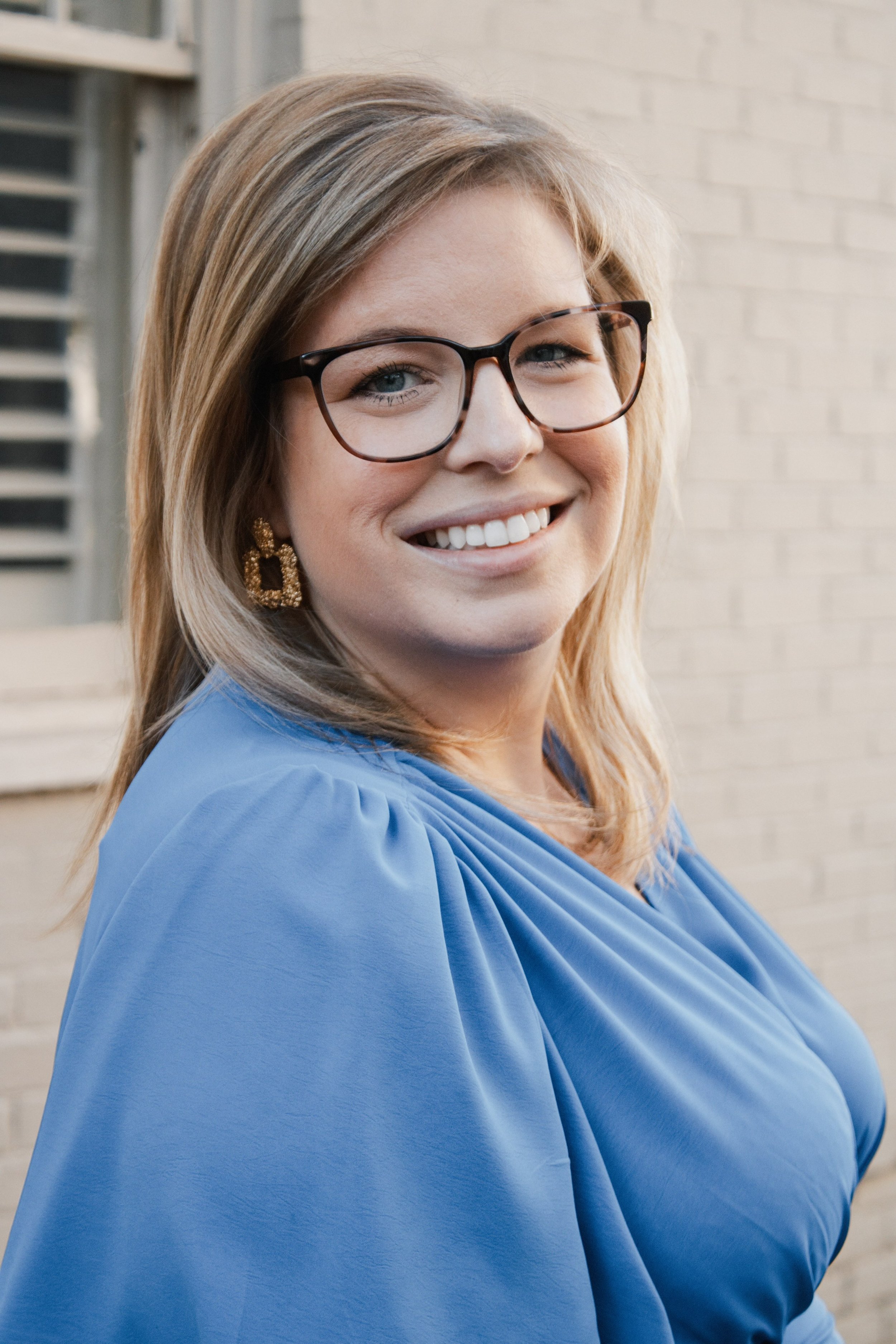 Allison Vega headshot in blue dress, A headshot of Allison Vega, Murfreesboro & Middle TN Real Estate Expert