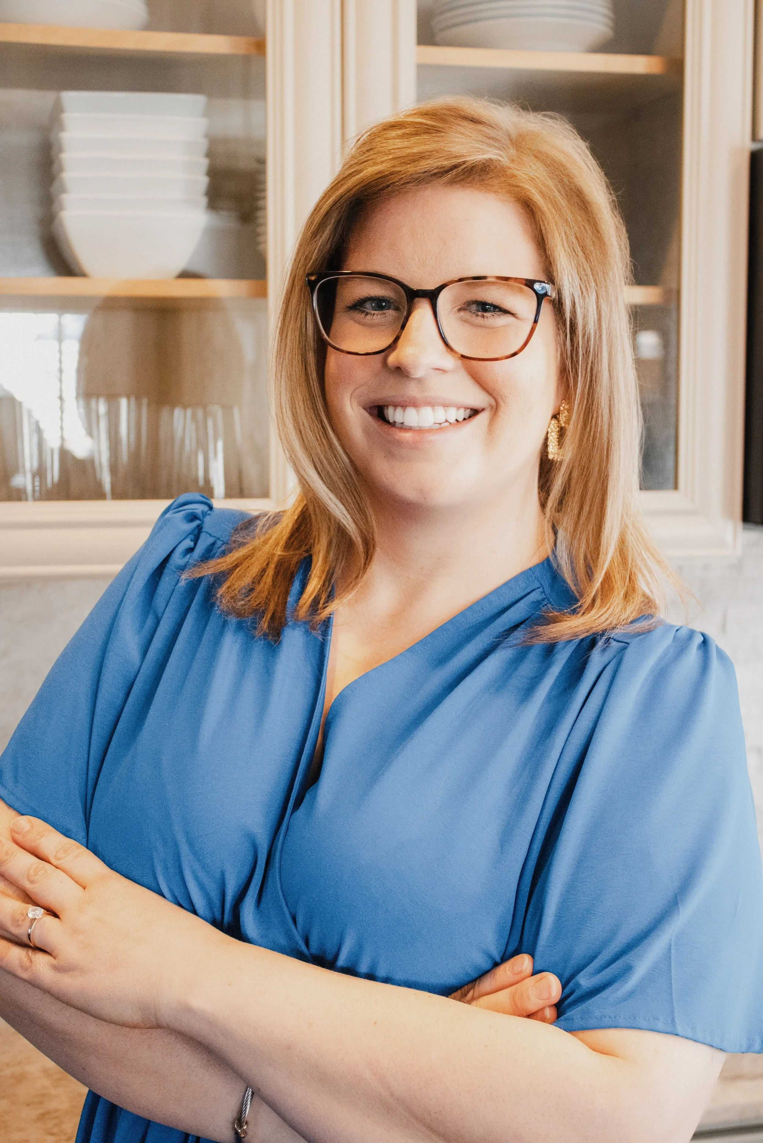 Allison Vega, A headshot of Allison Vega, Murfreesboro & Middle TN Real Estate Expert, in the kitchen inviting you to grab coffee with her