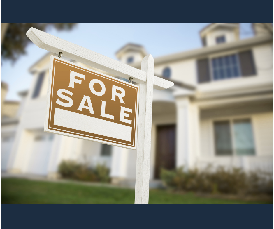 A traditional, luxury house with a sale sign in the front yard in Rutherford County